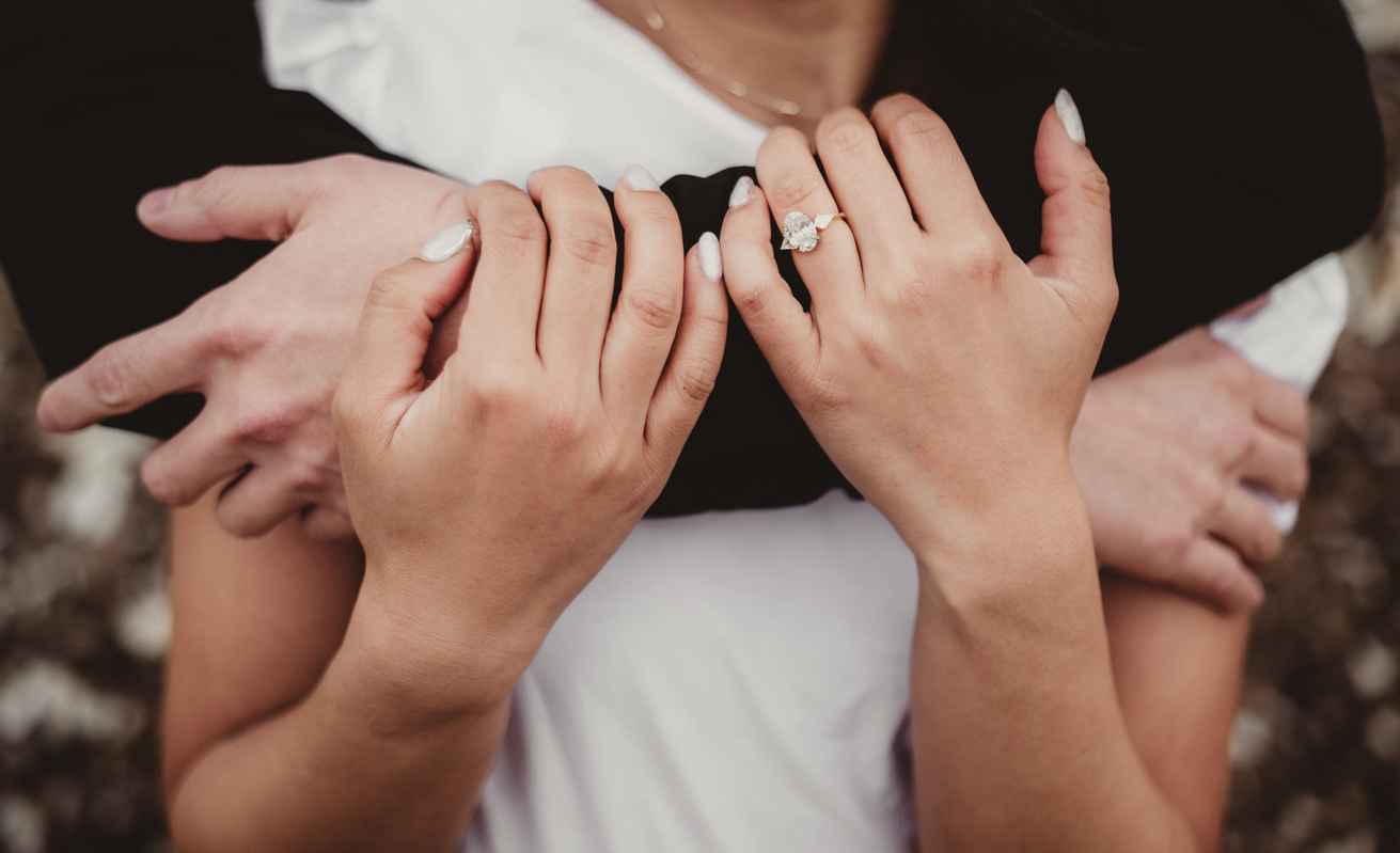Engaged couple embracing close up