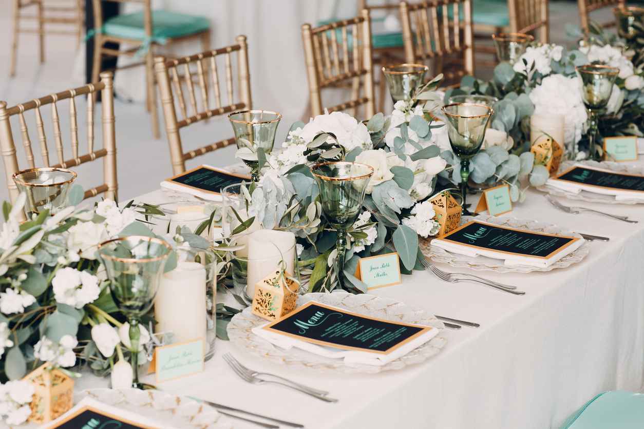 Wedding decor in a a table with white and green colors